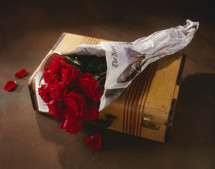 red roses on a suitcase 