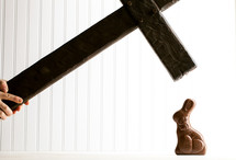 cross smashing a chocolate bunny