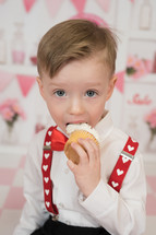 a child eating a cupcake 
