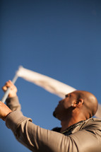 Man waving white flag.