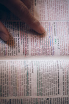 finger pointing to an underlined verse in a Bible - The Two Foundations