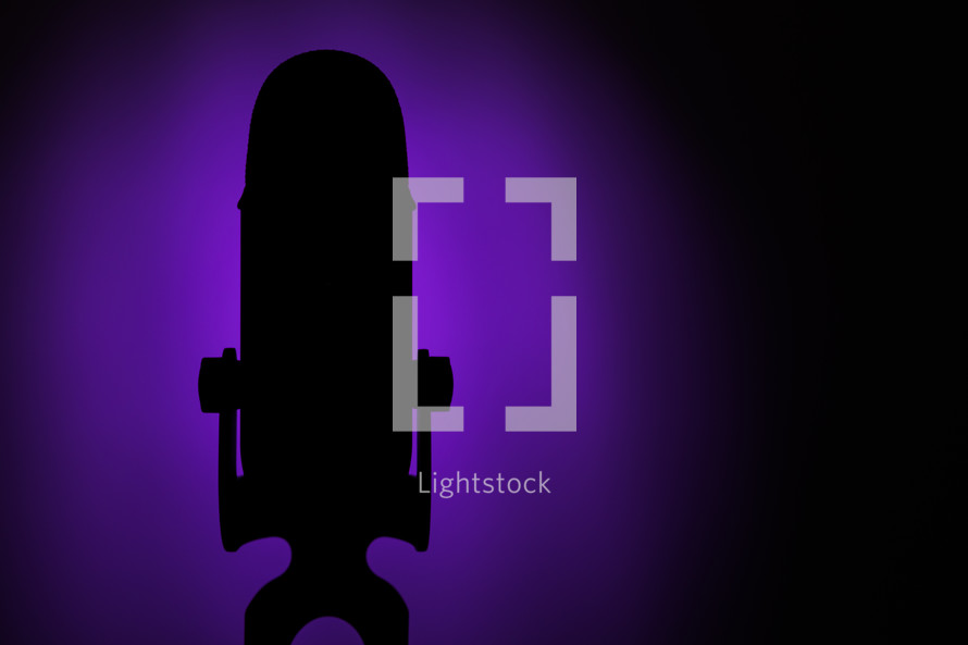 microphone silhouette on a purple background 