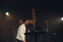 minister on stage during a contemporary worship service 
