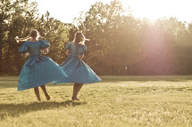 dancing girls in a field 