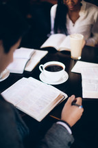 group reading from Bibles at a Bible study