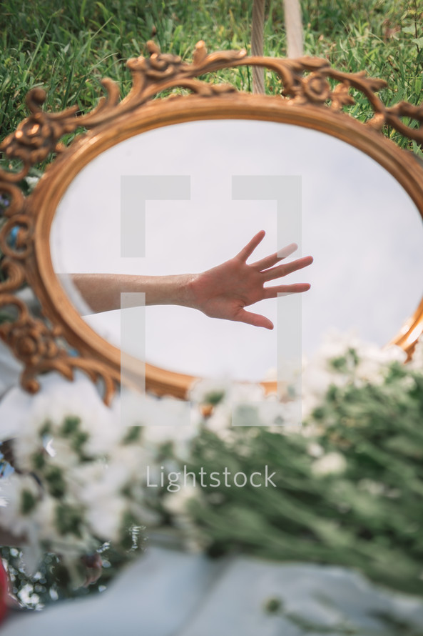 reflection of a hand in a mirror 