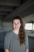 smiling young woman in a parking garage 