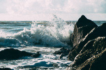 waves crashing into rocks