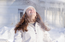 teen girl in falling snow 