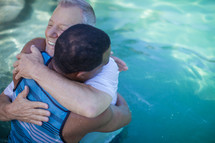 hugging after a baptism 