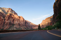 A highway through rocky mountains.