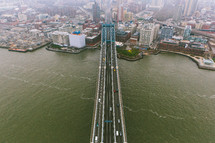aerial view over a city and bridge 