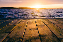 wood dock at sunset 