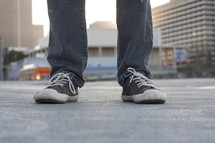 sneakers on a city sidewalk 
