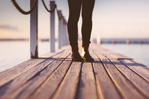 woman standing on a pier 