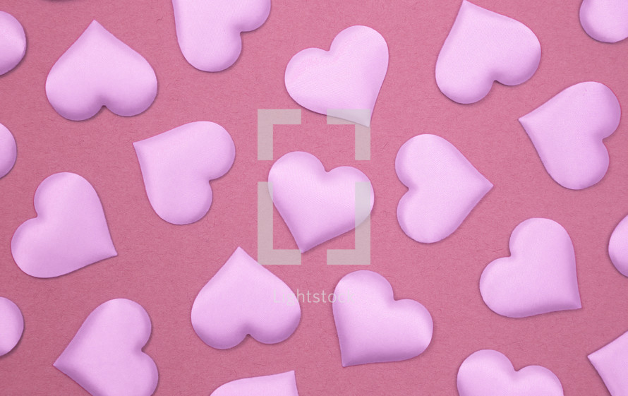 pink hearts on pink background 