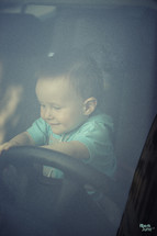 infant pretending to drive 