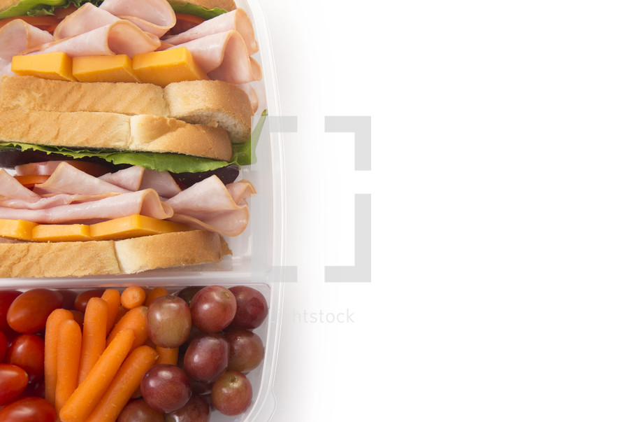 Healthy Packed Lunch of Ham Sandwich and Veggies