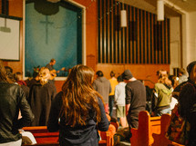 prayer and song during a worship service 