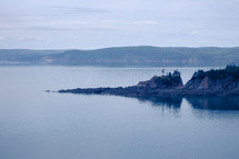 rock jetty in calm water 