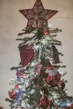 A decorated Christmas tree with a star on top
