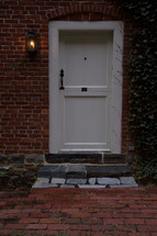 white door and brick patio 