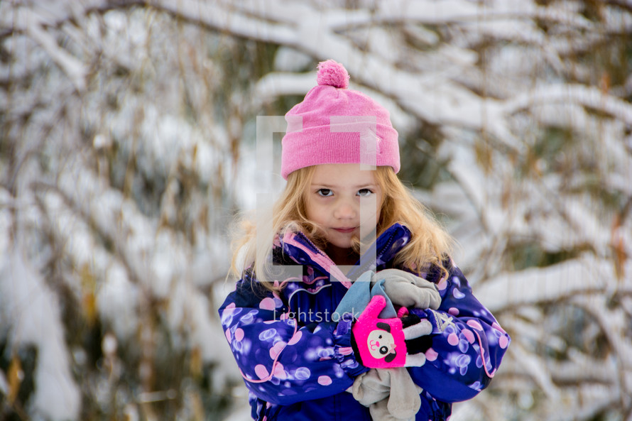 toddler girl in a winter snowsuit 