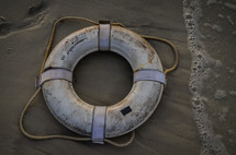 life preserver in the sand 