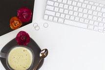 rings, coffee mug, spoon, plate, computer keyboard, tray, flowers, workspace, desk, home office, creamer, white background 
