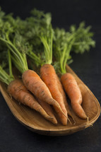 carrots in a wood bowl 