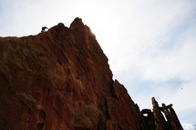man climbing a mountain 