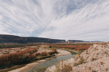 a river through a desert landscape 