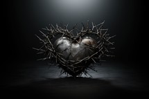The Sacred Heart, a heart with crown of thorns on dark background