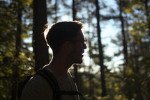 man hiking in a forest 