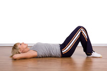 young woman doing sit-ups 