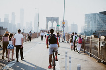 pedestrians crossing the Brooklyn bridge 