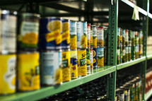 canned food on the shelves in a food pantry