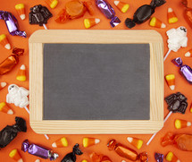 Halloween candy and blank sign 