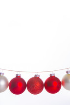 red and white Christmas ornaments hanging 