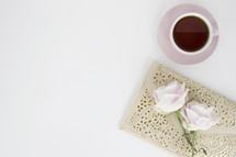 roses on a journal, and coffee mug