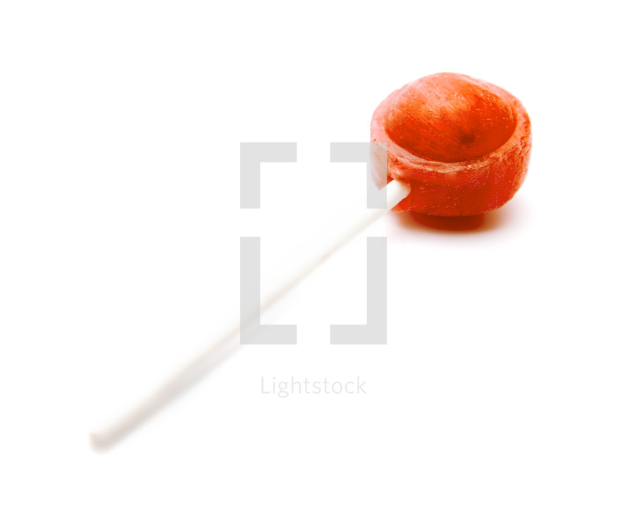 Single orange Lollipop on a White Background
