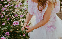 little girl picking flowers 
