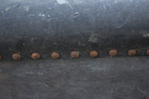 rusty buttons on a trunk 