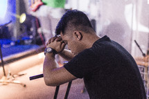 Man praying during worship.