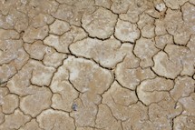Parched clay soil at the bottom of a lake during a drought