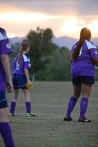 female athletes on the soccer field 