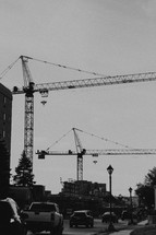 construction cranes in a city 