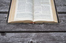 Old French Bible open on wood table