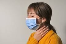 Woman Wearing Medical Protective Mask and Throat Pain