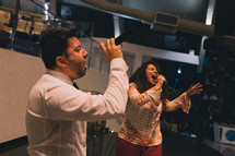 worship music, man and women singing passionately 
